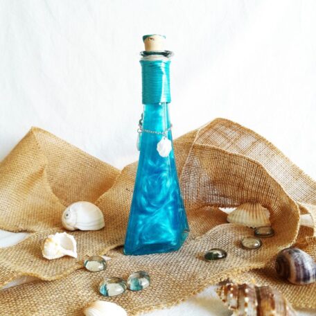 La mélodie des sirènes bleue potion décorative l'atelier des mystères vue de dos breloques